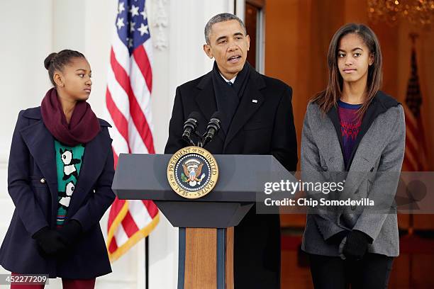 President Barack Obama delivers remarks with his daughters Malia Obama and Sasha Obama before pardoning the 2013 National Thanksgiving Turkey,...