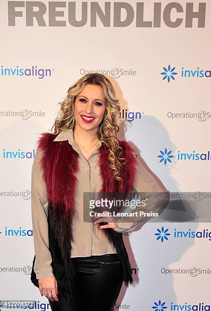 Verena Kerth poses during the photography exhibition "Bitte recht freundlich" of artist Niels Ruf on November 27, 2013 in Munich, Germany.