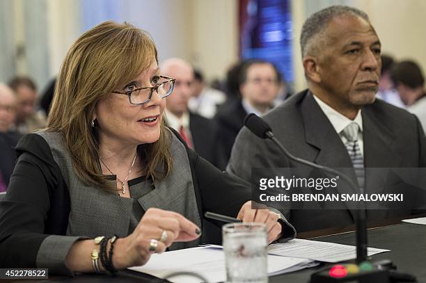 Rodney O'Neal , Chief Executive Officer and president of Delphi Automotive PLC, listens while Mary Barra, Chief Executive Officer of the General...