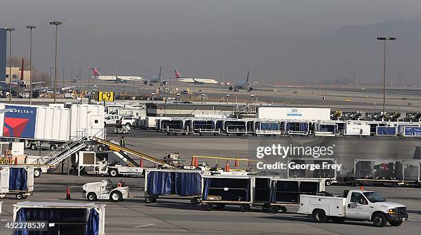 Delta planes stack up for take-off and are proceed through the Salt Lake City international Airport on November 27, 2013 in Salt Lake City, Utah. A...