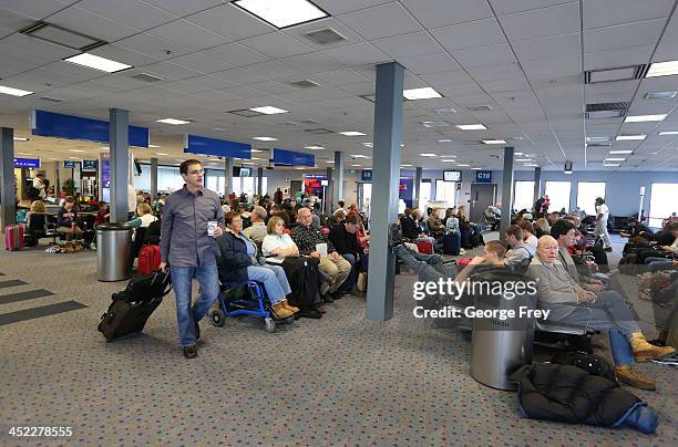 Holiday passengers wait to board their planes at the Salt Lake City international Airport on November 27, 2013 in Salt Lake City, Utah. A wintry...