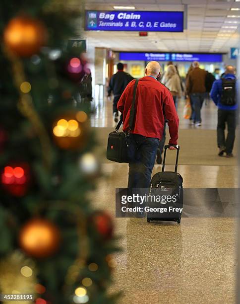 Holiday travelers make their way through the Salt Lake City international Airport on November 27, 2013 in Salt Lake City, Utah. A wintry storm system...