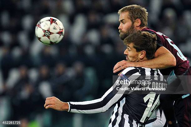 Fernando Llorente of Juventus is challenged by Olof Mellberg of FC Copenhagen during the UEFA Champions League Group B match between Juventus and FC...