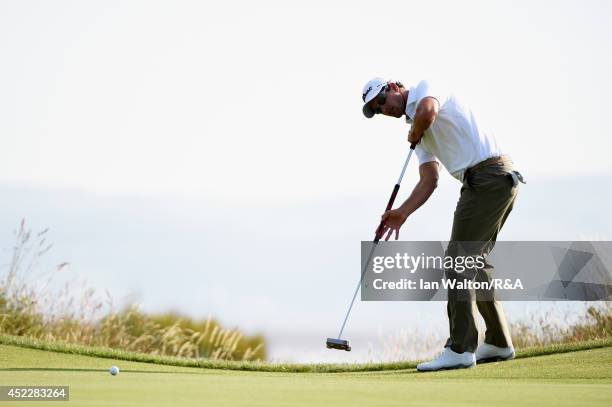 Adam Scott of Australia putts on the 14th green during the first round of The 143rd Open Championship at Royal Liverpool on July 17, 2014 in Hoylake,...