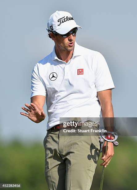 Adam Scott of Australia reacts to a putt on the 12th hole during the first round of The 143rd Open Championship at Royal Liverpool on July 17, 2014...