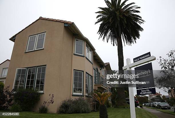 Sale pending sign is posted in front of a home for sale on July 17, 2014 in San Francisco, California. According to a report by DataQuick, the median...