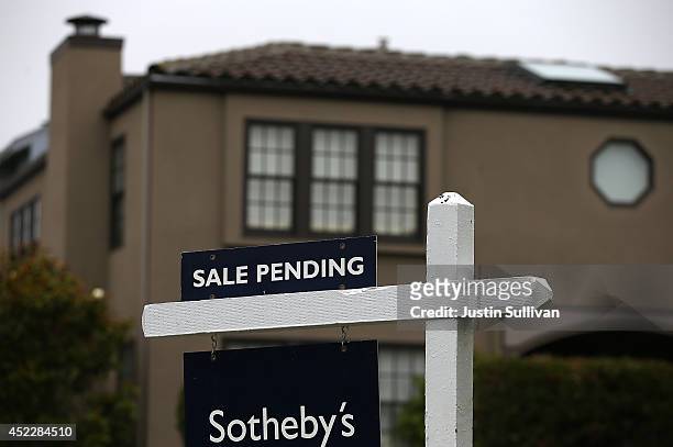 Sale pending sign is posted in front of a home for sale on July 17, 2014 in San Francisco, California. According to a report by DataQuick, the median...