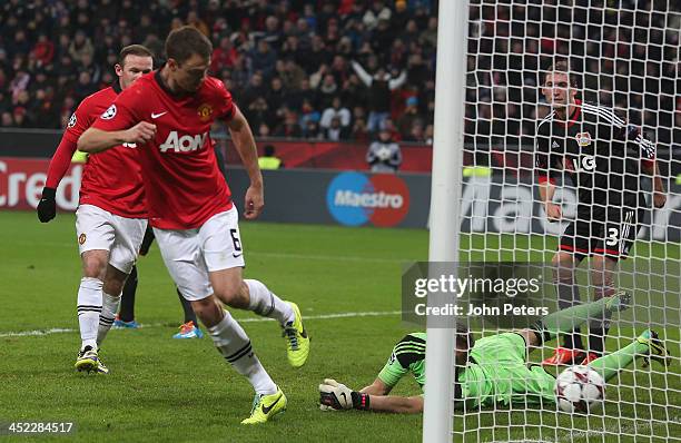 Jonny Evans of Manchester United scores their third goal during the UEFA Champions League Group A match between Bayer Leverkusen and Manchester...