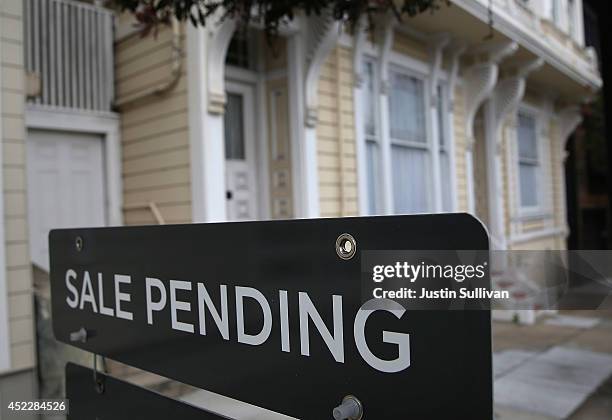 Sale pending sign is posted in front of a home for sale on July 17, 2014 in San Francisco, California. According to a report by DataQuick, the median...