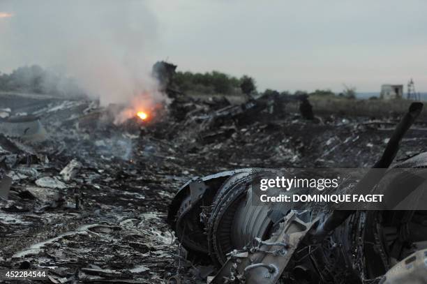 Picture taken on July 17, 2014 shows wreckages of the malaysian airliner carrying 295 people from Amsterdam to Kuala Lumpur after it crashed, near...