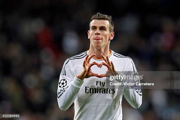 Gareth Bale of Real Madrid celebrates after scoring the opening goal during the UEFA Champions League Group B match between Real Madrid and...