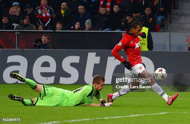 Luis Nani of Manchester United rounds Bernd Leno of Bayer Leverkusen to score their fifth goal during the UEFA Champions League Group A match between...