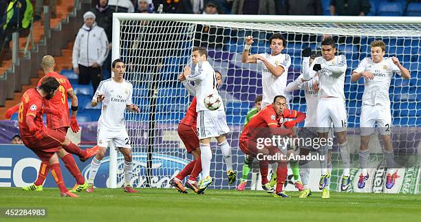 Galatasaray's Selcuk Inan performs a freekick during the UEFA Champions League football match between Real Madrid vs Galatasaray at the Santiago...