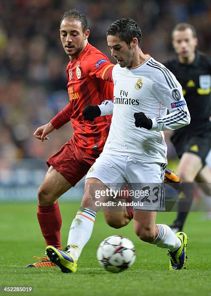 Galatasaray's Nordin Amrabat vies with Real Madrid's Isco during the UEFA Champions League football match between Real Madrid vs Galatasaray at the...