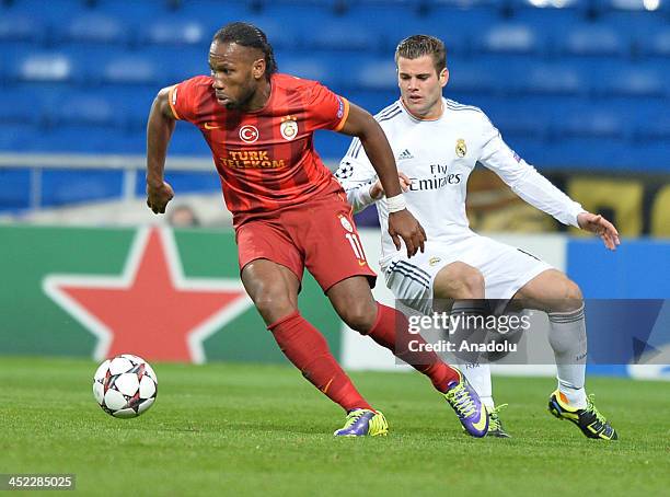 Galatasaray's Didier Drogba vies for the ball during the UEFA Champions League football match between Real Madrid vs Galatasaray at the Santiago...