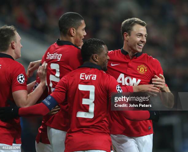Jonny Evans of Manchester United celebrates scoring their third goal during the UEFA Champions League Group A match between Bayer Leverkusen and...