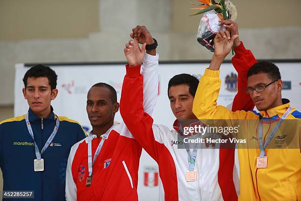 Silver medalist Sergio Garcia of Ecuador, gold medalist Wilkin Herencia of Dominican Republic and bronze medalists Josue Chavez of Peru with Jose...