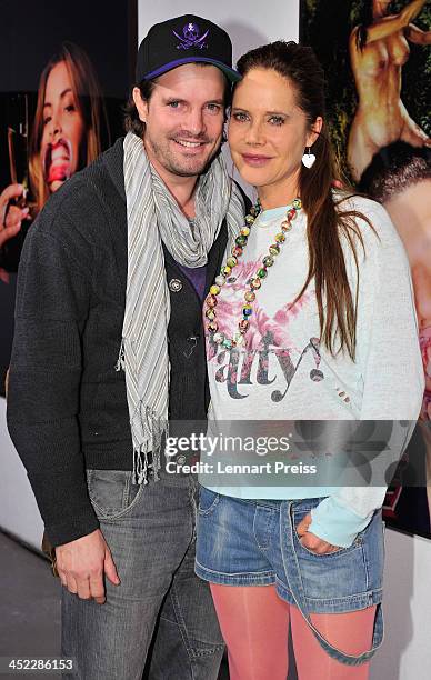 Doreen Dietel and Tobias Guttenberg pose during the photography exhibition "Bitte recht freundlich" of artist Niels Ruf on November 27, 2013 in...