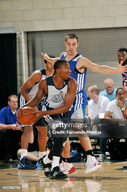 Nolan Smith of the Oklahoma City Thunder drives against the Philadelphia 76ers during the Samsung NBA Summer League 2014 on July 6, 2014 at Amway...