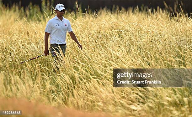Adam Scott of Australia walks through long grass during the first round of The 143rd Open Championship at Royal Liverpool on July 17, 2014 in...