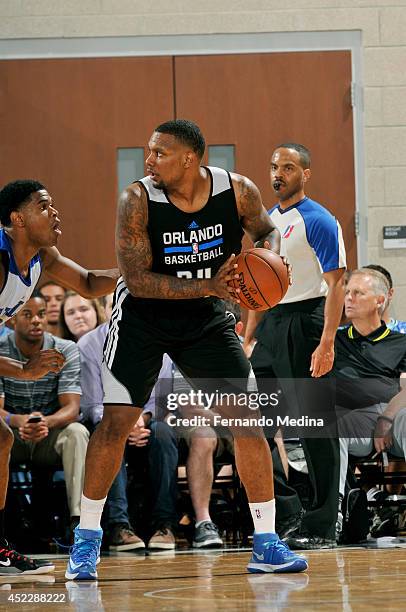 Romero Osby of the Orlando Magic handles the ball against the Philadelphia 76ers during the Samsung NBA Summer League 2014 on July 5, 2014 at Amway...