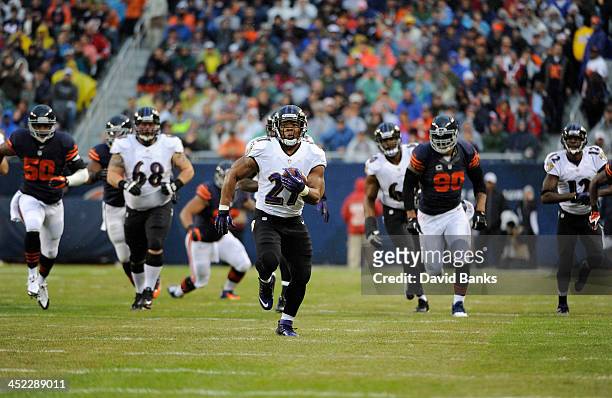 Ray Rice of the Baltimore Ravens runs against the Chicago Bears on November 17, 2013 at Soldier Field in Chicago, Illinois.