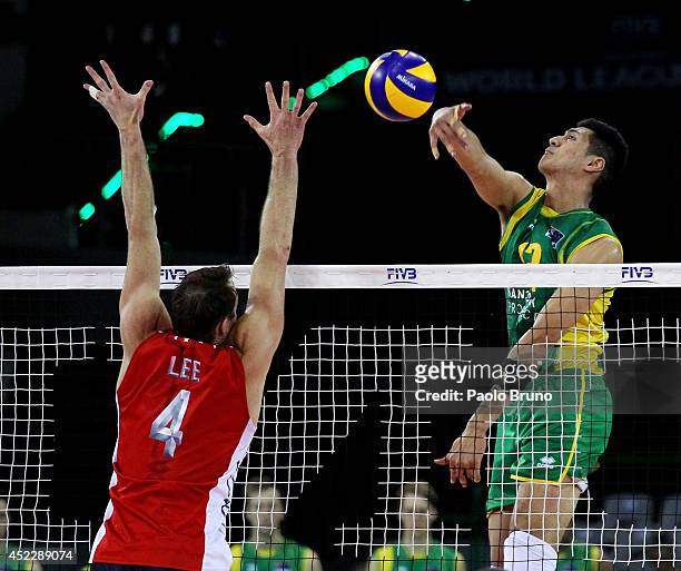 Mote Nehemiah of Australia spikes the ball as David Lee of United States block during the FIVB World League Final Six match between United States and...