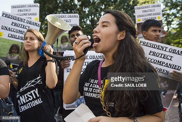 Demonstrators with the groups Amnesty International and We Belong Together protest in favor of keeping unaccompanied children who entered the US...