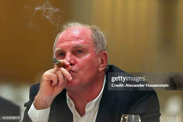 Uli Hoeness, President of Bayern Muenchen enjoys a cigar during the Champions Dinner at RitzCarlon Hotel Moscow after winning UEFA Champions League...