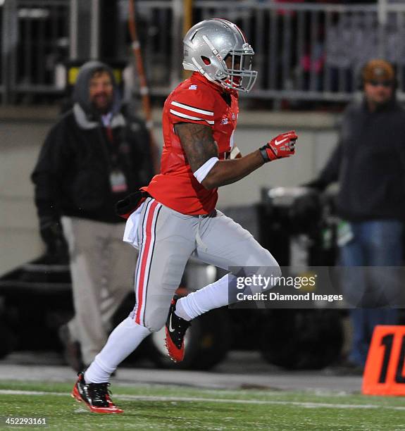 Running back Dontre Wilson of the Ohio State Buckeyes runs the football into the end zone to score a touchdown during a game against the Indiana...