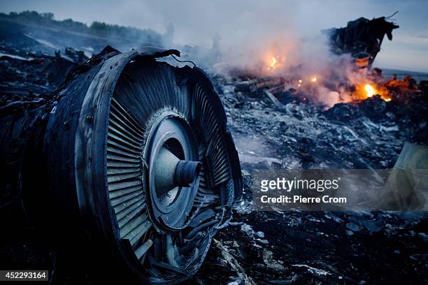 Debris from Malaysia Airlines Flight 17 is shown smouldering in a field July 17, 2014 in Grabovo, Ukraine near the Russian border. Flight 17, on its...