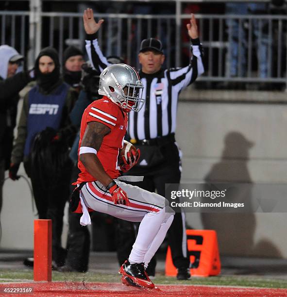 Running back Dontre Wilson of the Ohio State Buckeyes runs the football into the end zone to score a touchdown during a game against the Indiana...