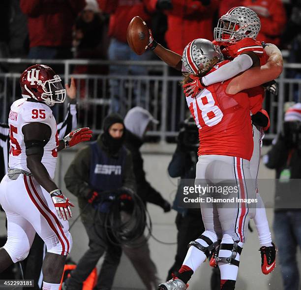 Running back Dontre Wilson Andrew Norwell of the Ohio State Buckeyes celebrate after a Wilson touchdown during a game against the Indiana Hoosiers at...