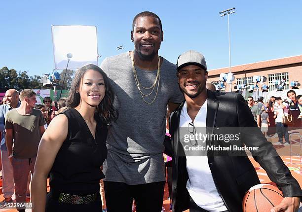 College basketball player Anna Wilson with NBA player Kevin Durant and NFL quarterback Russell Wilson attends Nickelodeon Kids' Choice Sports Awards...