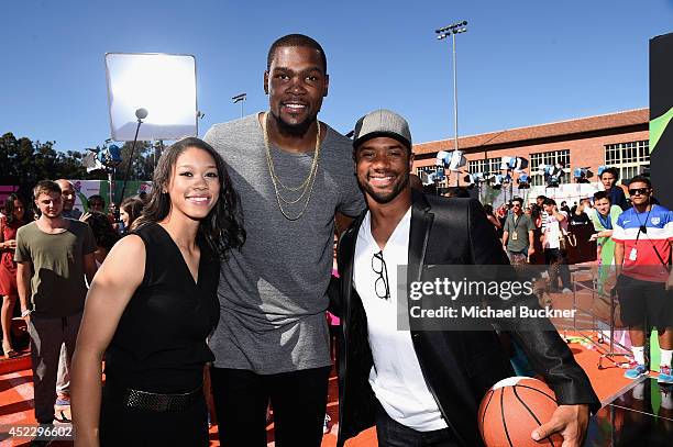 College basketball player Anna Wilson with NBA player Kevin Durant and NFL player Russell Wilson attends Nickelodeon Kids' Choice Sports Awards 2014...