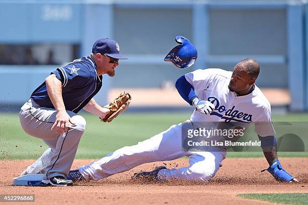 Carl Crawford of the Los Angeles Dodgers steals second base in the second inning against Brooks Conrad of the San Diego Padres at Dodger Stadium on...