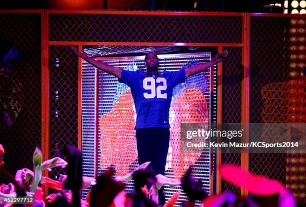 Host Michael Strahan speaks onstage Nickelodeon Kids' Choice Sports Awards 2014 at UCLA's Pauley Pavilion on July 17, 2014 in Los Angeles, California.