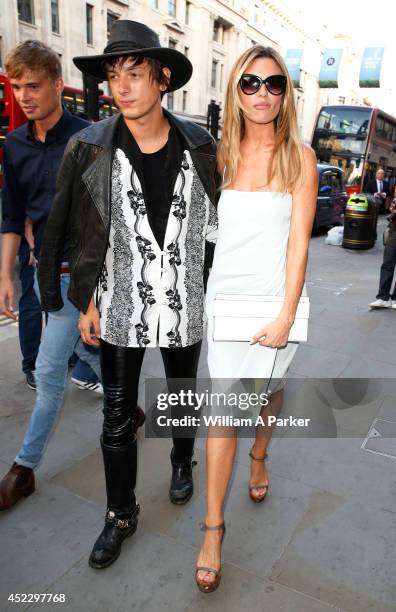 Damon Baker and Abbey Clancy arrive at The Watches Of Switzerland store launch party on July 17, 2014 in London, England.