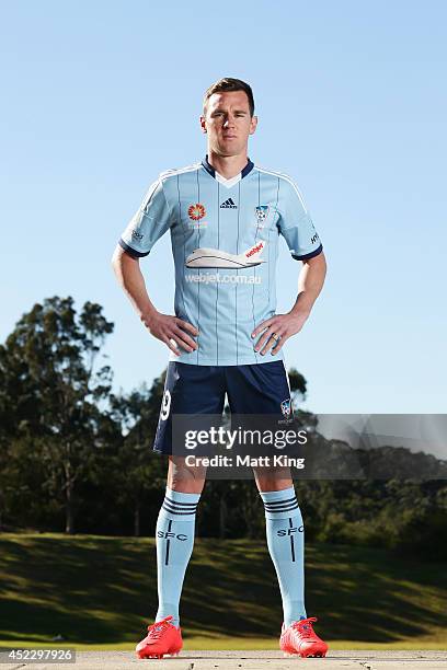 Shane Smeltz poses as he unveils the new Sydney FC jersey during a Sydney FC A-League training session at Macquarie Uni on July 18, 2014 in Sydney,...