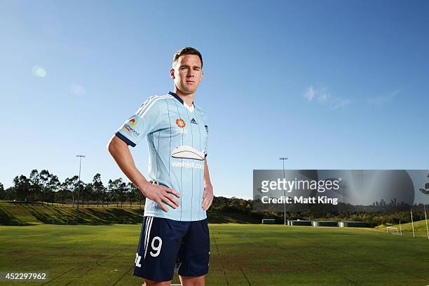 Shane Smeltz poses as he unveils the new Sydney FC jersey during a Sydney FC A-League training session at Macquarie Uni on July 18, 2014 in Sydney,...