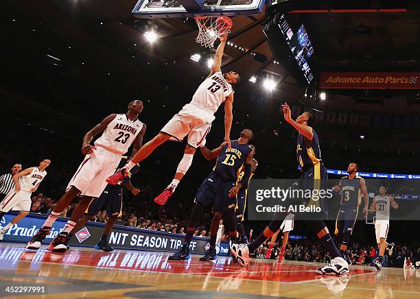 Nick Johnson of the Arizona Wildcats scores against the Drexel Dragons during their Semi Final game of the NIT Season Tip Off at Madison Square...