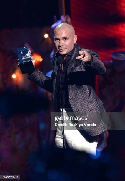 Pitbull accepts award onstage during the Premios Juventud 2014 at The BankUnited Center on July 17, 2014 in Coral Gables, Florida.
