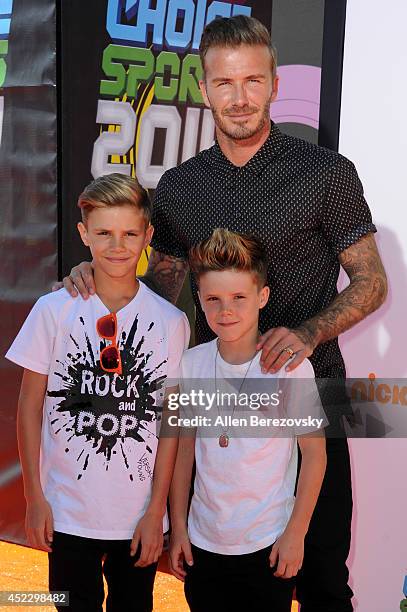 Former soccer player David Beckham, Romeo James Beckham and Cruz David Beckham attend Nickelodeon Kids' Choice Sports Awards 2014 at Pauley Pavilion...