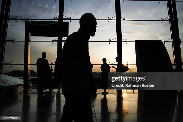 Passengers wait for their flight at Kuala Lumpur International Airport Terminal 1 on July 18, 2014 in Putrajaya, Malaysia. Malaysia Airlines flight...