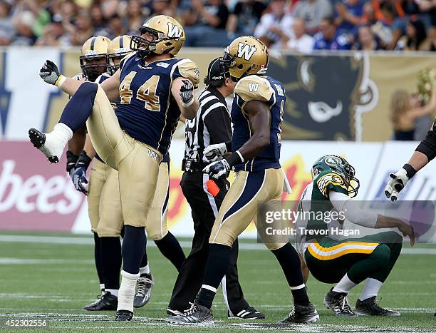 July 17: Winnipeg Blue Bombers' Zach Anderson celebrates after sacking Edmonton Eskimos' quarterback Mike Reilly during first half CFL Football at...