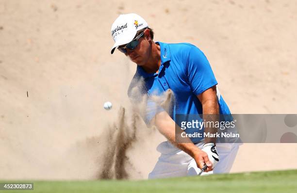 Scott Laycock of Australia plays out of a bunker during day one of the 2013 Australian Open at Royal Sydney Golf Club on November 28, 2013 in Sydney,...