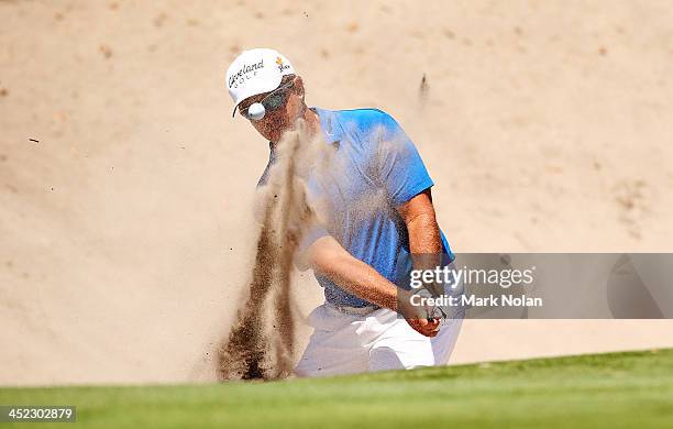 Scott Laycock of Australia plays out of a bunker during day one of the 2013 Australian Open at Royal Sydney Golf Club on November 28, 2013 in Sydney,...