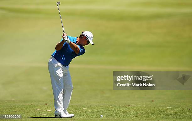 Scott Laycock of Australia plays an approach shot during day one of the 2013 Australian Open at Royal Sydney Golf Club on November 28, 2013 in...