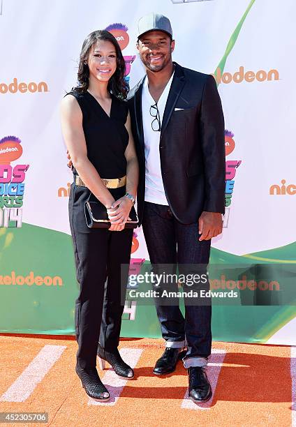 Player Russell Wilson and his sister Anna Wilson arrive at the Nickelodeon Kids' Choice Sports Awards 2014 on July 17, 2014 in Los Angeles,...