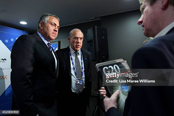 Joe Hockey, Australian Treasurer and Angel Gurria, Secretary-General OECD attend a press conference during the B20 Summit at on July 18, 2014 in...
